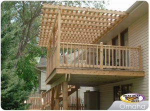 A second story cedar deck with a pergola