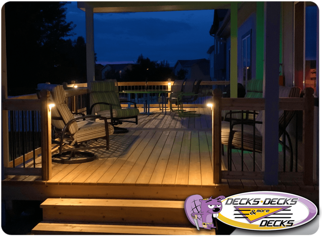 Spacious backyard deck with integrated LED lighting and dining space in Elkhorn, Nebraska