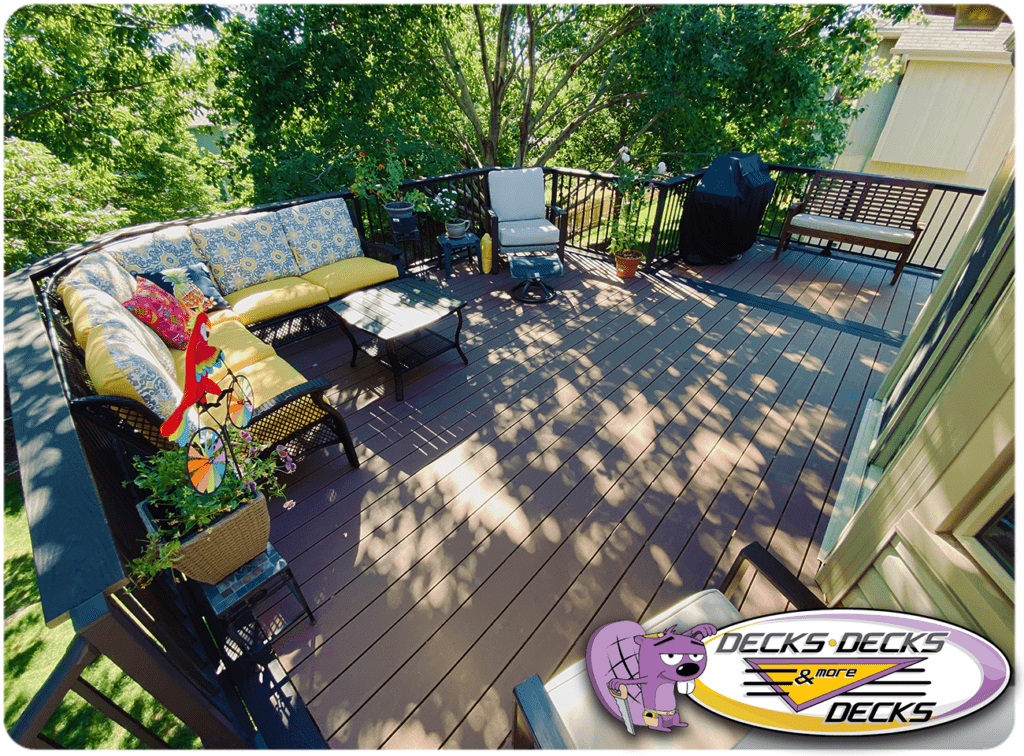 Ralston composite deck furnished with patio chairs, sectional seating, and fire table