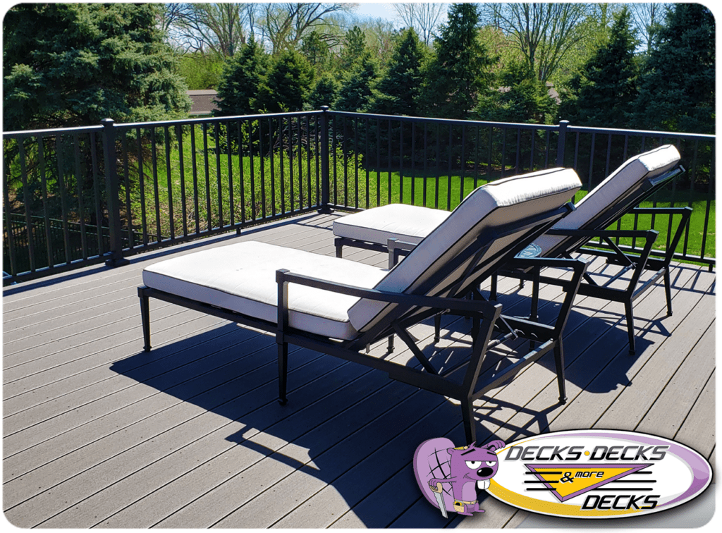 Bellevue composite deck featuring outdoor coffee table and lounge chairs