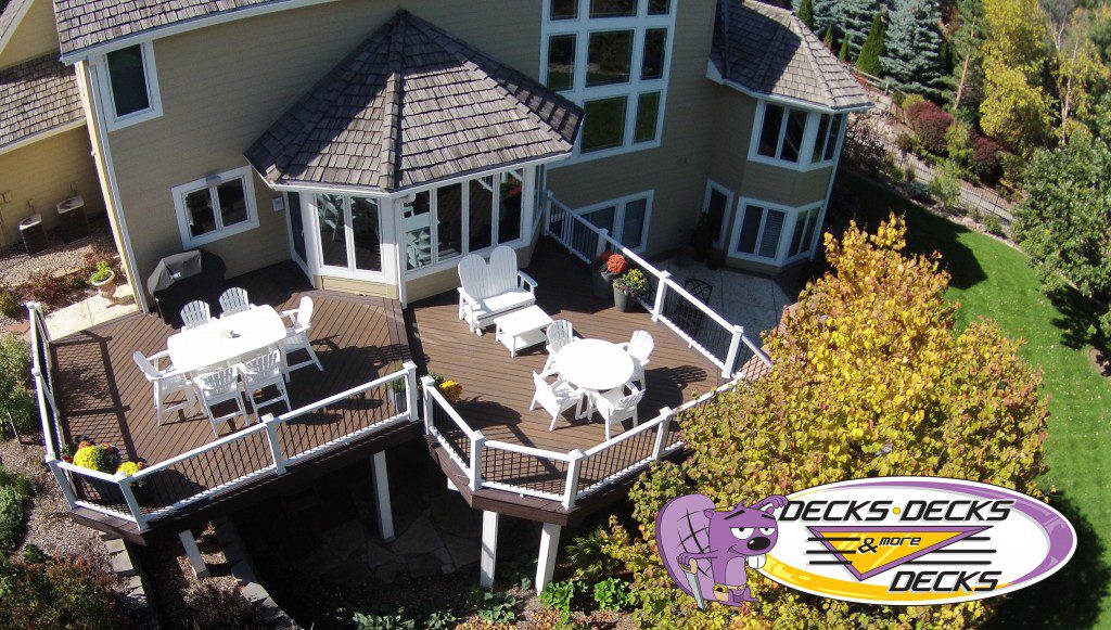 Springfield composite deck styled with outdoor dining table, lanterns, and seasonal décor