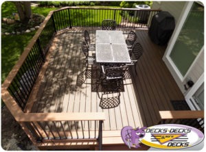 A custom low maintainence deck with drink rails.