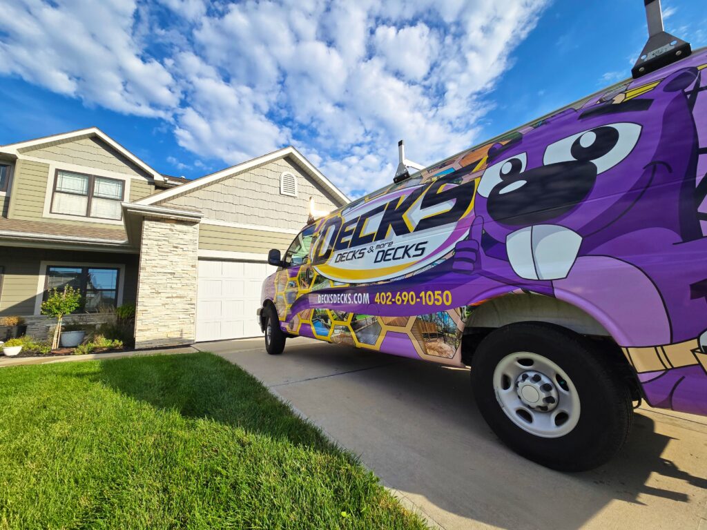 Decks, Decks & More Decks branded logo on van or showroom display