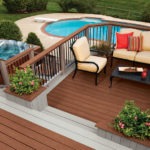 patio furniture and table settings on a second story deck